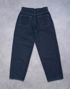 Model wearing Lowrie low rise baggy jeans in indigo rinse