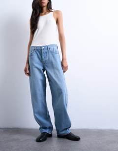 Model wearing Lowrie low rise baggy jeans in vintage blue