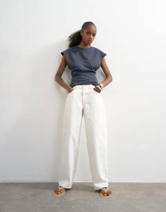 Model wearing Lowrie low rise boyfriend jean in white