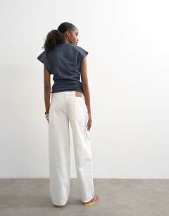 Model wearing Lowrie low rise boyfriend jean in white