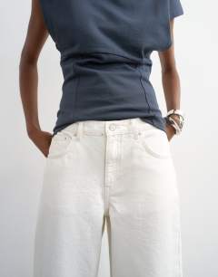 Model wearing Lowrie low rise boyfriend jean in white