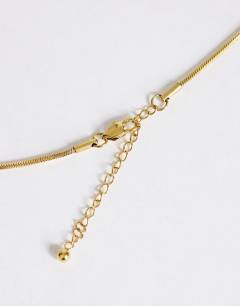 Model wearing Lucas waterproof teardrop lariat necklace in stainless gold