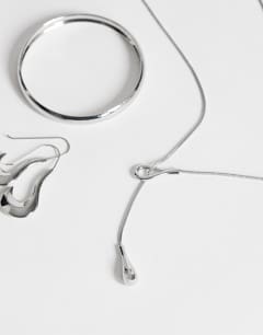 Model wearing Lucas waterproof teardrop lariat necklace in stainless silver