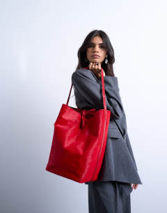 Model wearing Luna hair on real leather tote bag in red