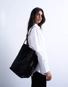 Model wearing Luna large hair on real leather tote bag in black