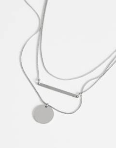 Model wearing Lyra waterproof 3 pack necklaces in stainless silver