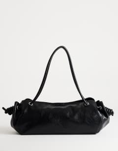Model wearing Maddie large shoulder bag in black