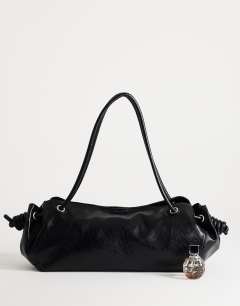 Model wearing Maddie large shoulder bag in black