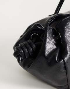 Model wearing Maddie large shoulder bag in black