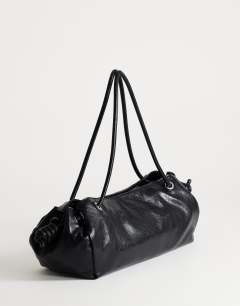 Model wearing Maddie large shoulder bag in black
