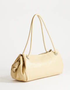 Model wearing Maddie large shoulder bag in buttermilk