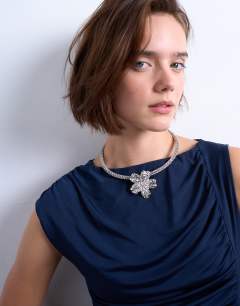 Model wearing Maeve floral diamante necklace in silver