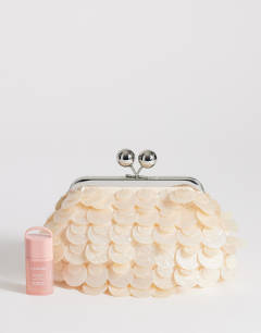 Model wearing Maeve small embellished clutch in off white