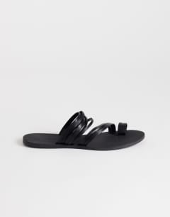 Model wearing Maeve strappy toe loop sandal in black
