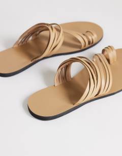 Model wearing Maeve strappy toe loop sandal in camel