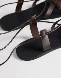 Model wearing Maisie strappy flat sandal in chocolate