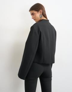 Model wearing Mandarin collar blazer in black