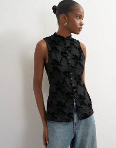 Model wearing Mandarin lace velvet mix button down longline top in black