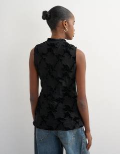 Model wearing Mandarin lace velvet mix button down longline top in black