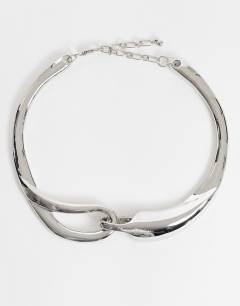 Model wearing Mario statement necklace in silver