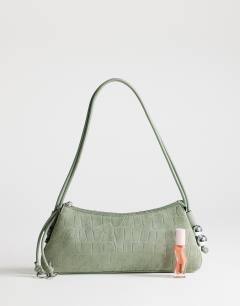 Model wearing Marley small croc suede shoulder bag in green