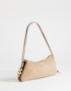 Model wearing Marley small croc suede shoulder bag in taupe