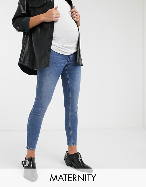 Topshop Maternity Jamie overbump skinny jeans in mid wash