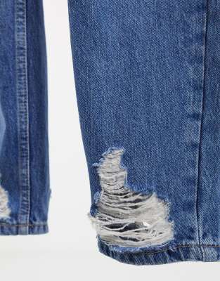 mid blue ripped mom tapered jeans