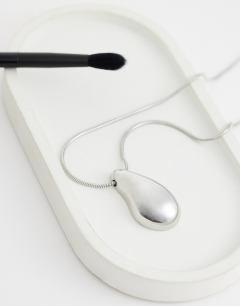 Model wearing Matilda teardrop pendant necklace in silver