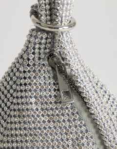 Model wearing Matty small diamante triangle grab bag with tassels in silver