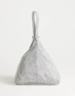 Model wearing Matty small diamante triangle grab bag with tassels in silver