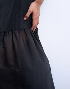 Model wearing Maxi dress with sheer layered volume skirt in black