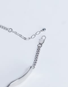 Model wearing Megan statement necklace in silver
