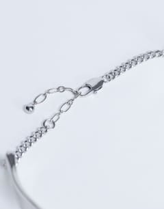 Model wearing Megan statement necklace in silver