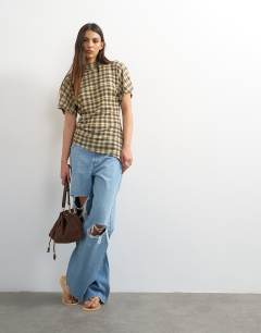 Model wearing Mesh check funnel tunic top in check print