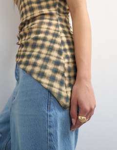 Model wearing Mesh check funnel tunic top in check print