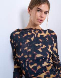 Model wearing Mesh cowl neck tortoise shell animal print long sleeve top in black