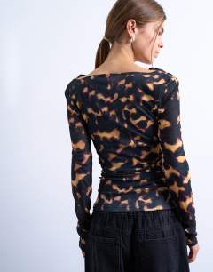 Model wearing Mesh cowl neck tortoise shell animal print long sleeve top in black