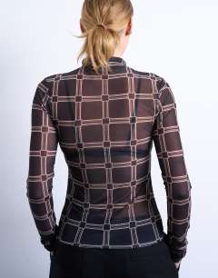 Model wearing Mesh high neck check print long sleeve top in black