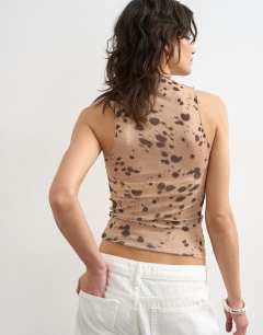 Model wearing Mesh high neck sleeveless top in deer print