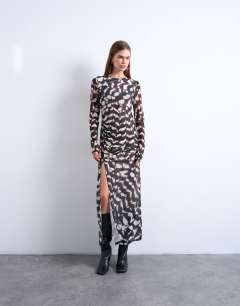 Model wearing Mesh maxi animal print long sleeve dress in multi