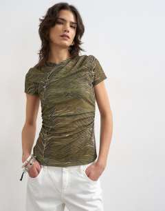 Model wearing Mesh ruched wrap short sleeve top in green