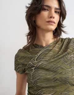 Model wearing Mesh ruched wrap short sleeve top in green
