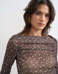 Model wearing Mesh slash neck long sleeve top in polka dot