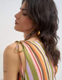 Model wearing Mesh stripe ruched shoulder asymmetric top in orange