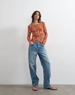 Model wearing Mesh tie front long sleeve top in deer print