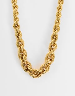 Model wearing Mia twist necklace in gold