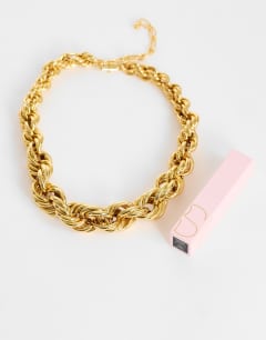 Model wearing Mia twist necklace in gold
