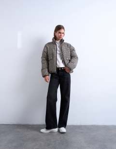 Model wearing Micro check funnel neck puffer jacket in black