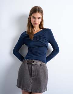 Model wearing Microfibre draped long sleeve top in navy